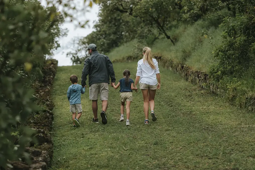 A family walking through the highland landscape
