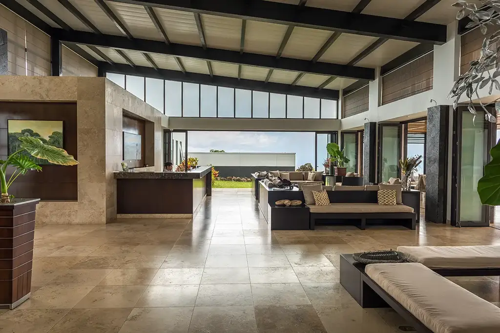 Guest relaxing at Pikaia Lodge with panoramic highland views
