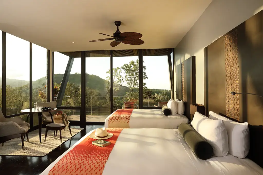 Suite interior with panoramic windows at Pikaia Lodge
