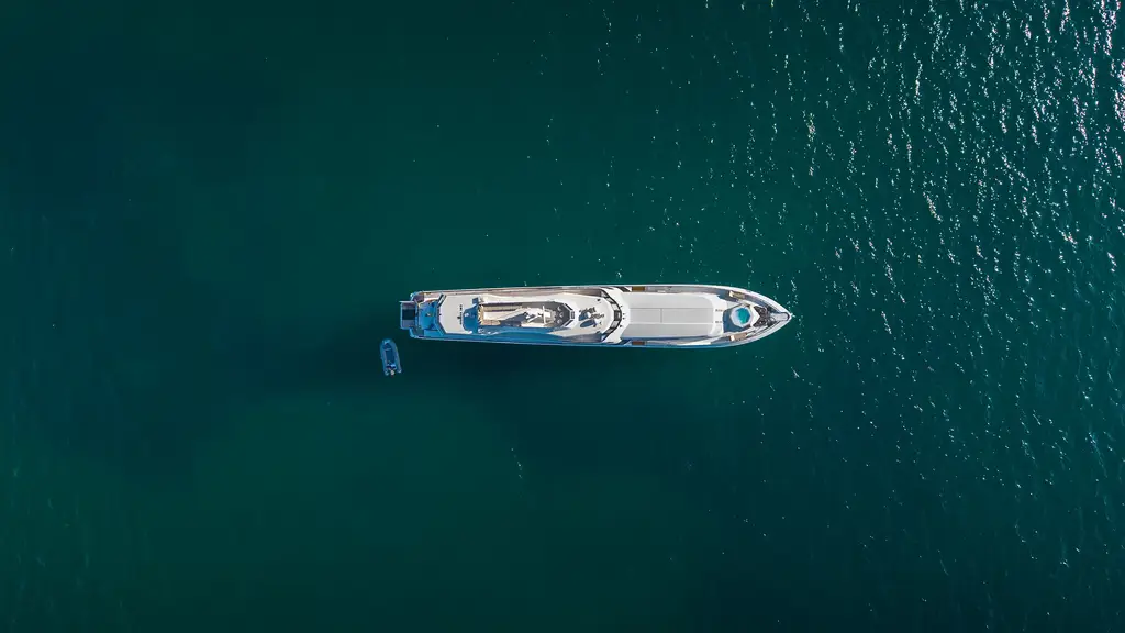 Aerial view of a yacht in deep blue Galápagos waters
