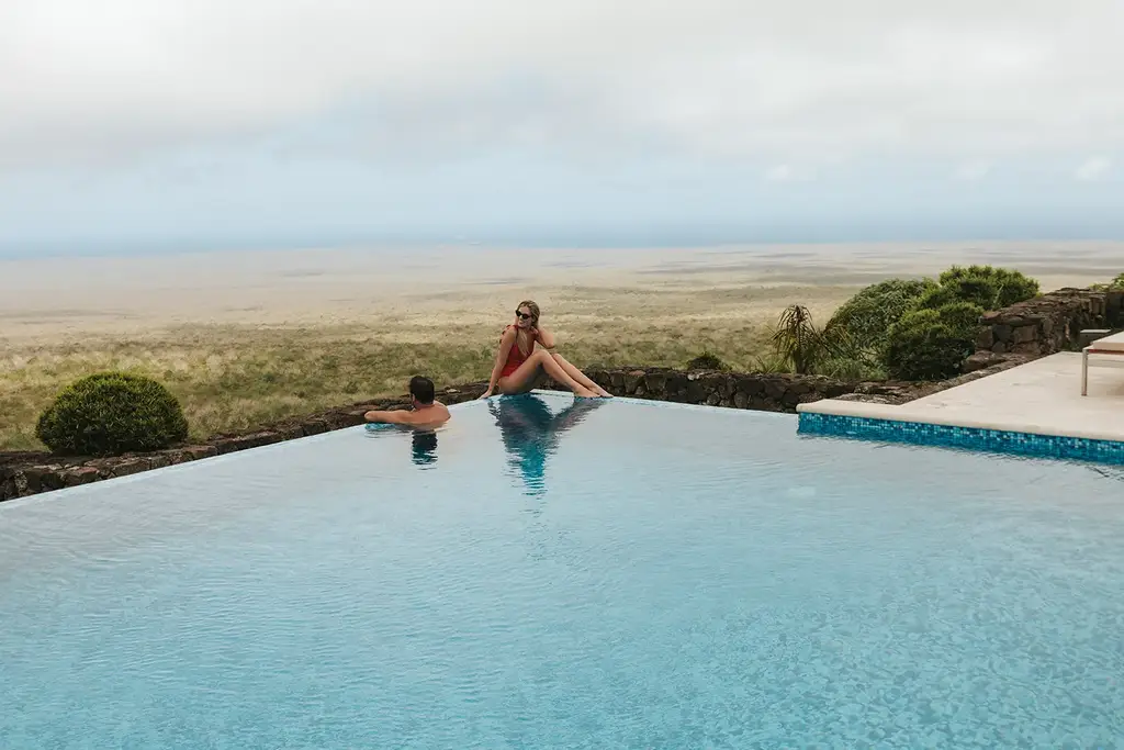 Lounge chairs by the infinity pool